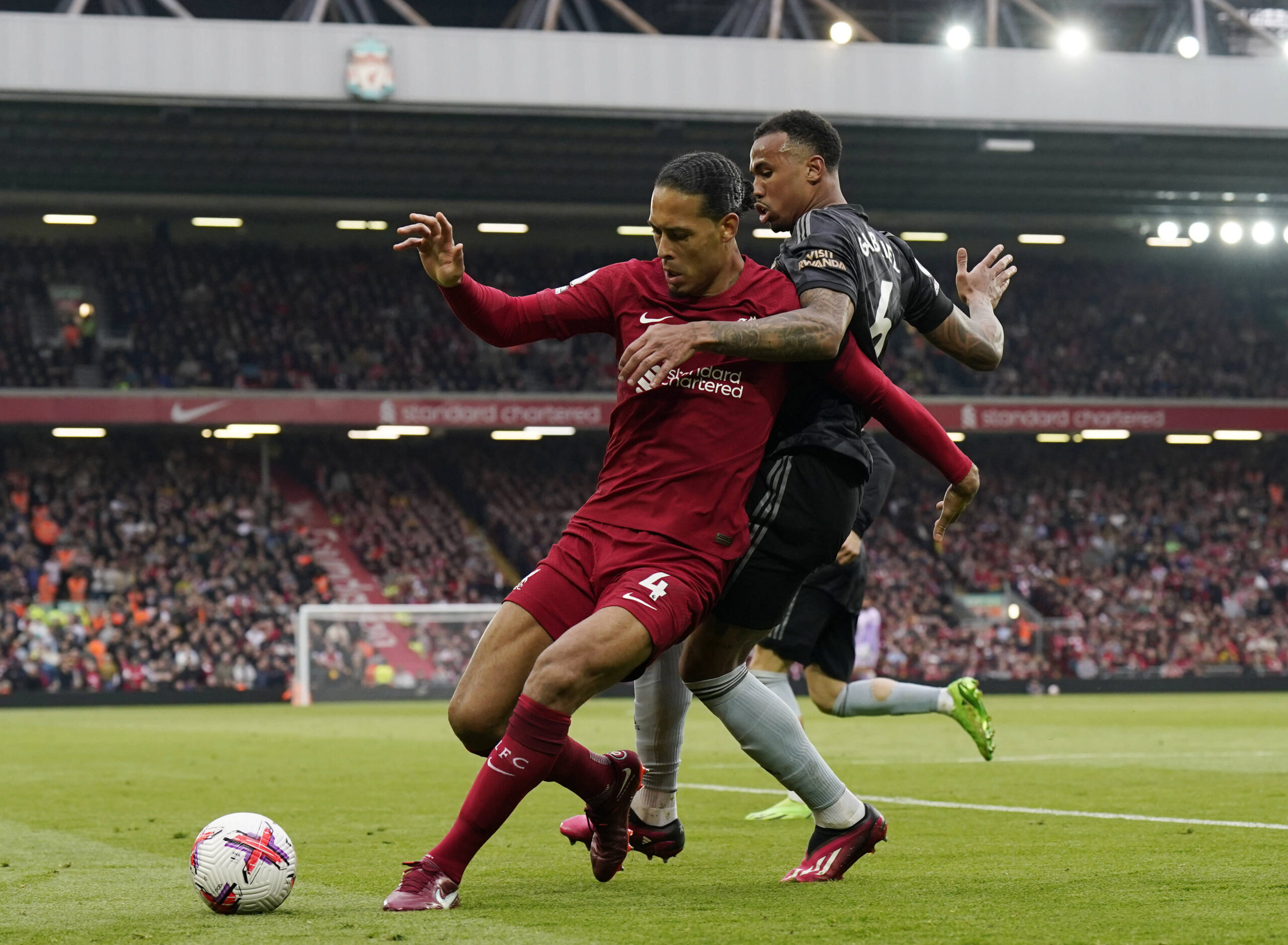 Gabriel of Arsenal challenges Virgil van Dijk of Liverpool during the Premier League match at Anfield, Liverpool./ IMAGO / Newscom World