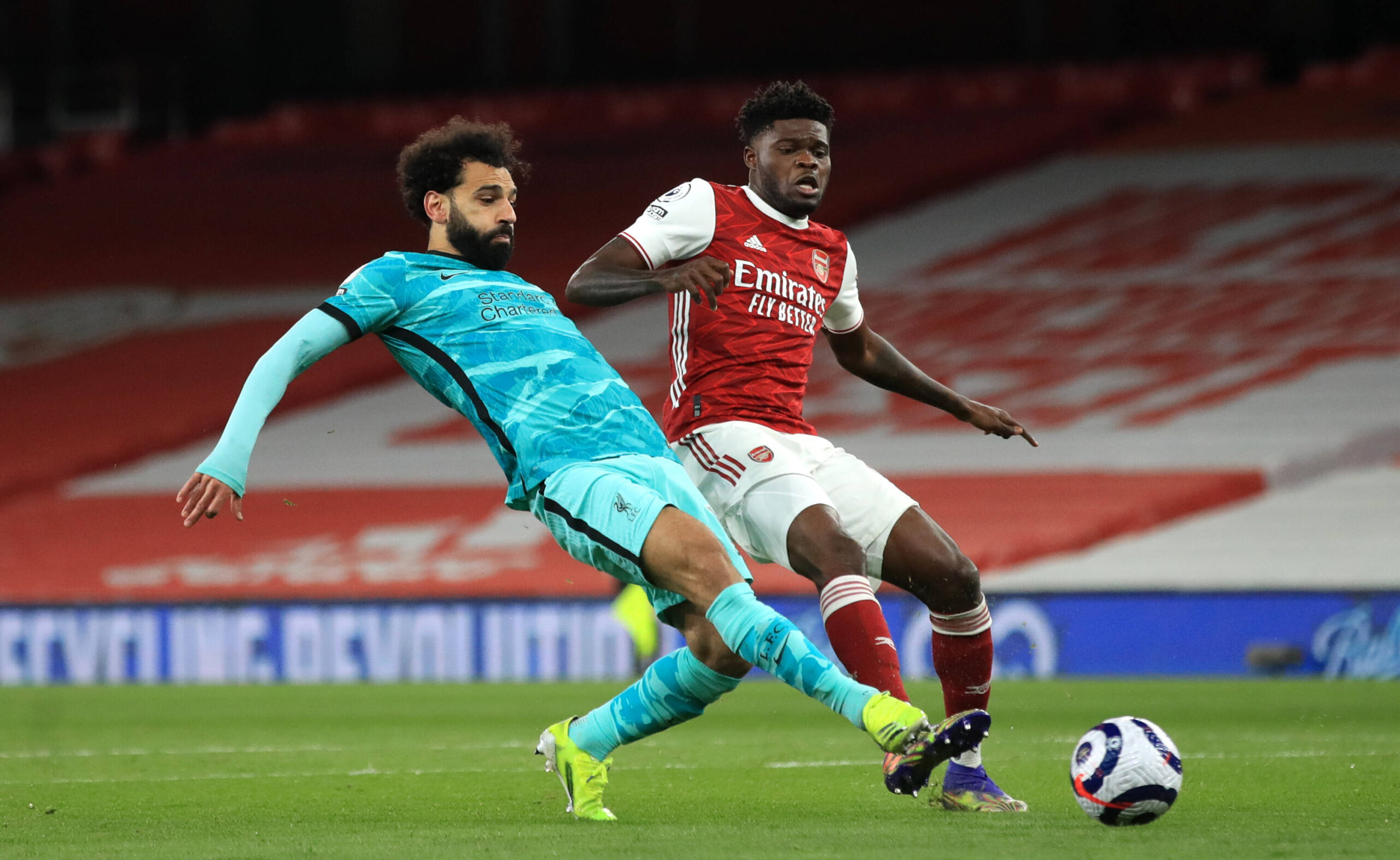 Arsenal v Liverpool - Premier League - Emirates Stadium Liverpool s Mohamed Salah left and Arsenal s Thomas Partey right battle for the ball during the Premier League match at The Emirates Stadium, / IMAGO / PA Images