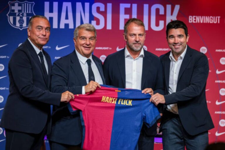 hansi flick with barcelona board